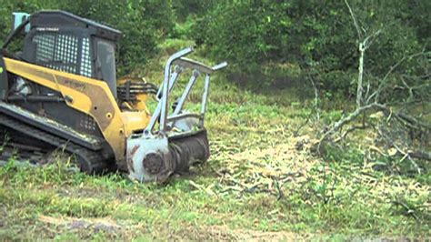 clearing trees with a skid steer|skid steer clearance.